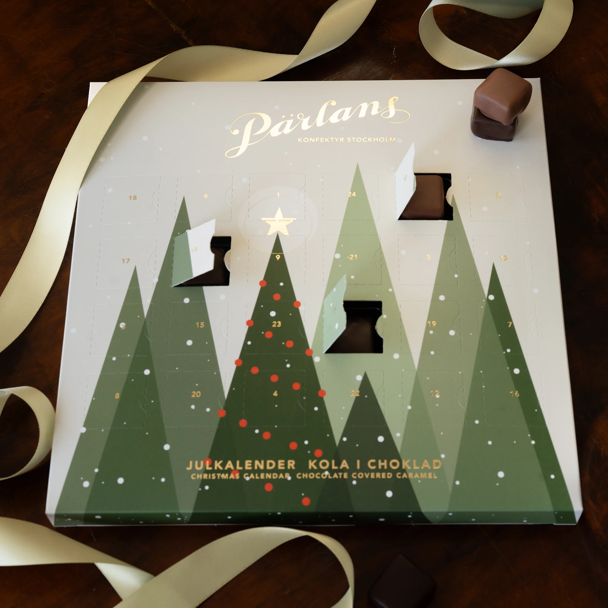 Produktbild för Julkalender Pärlans Konfektyr, 24 chokladdoppade bitar 300g